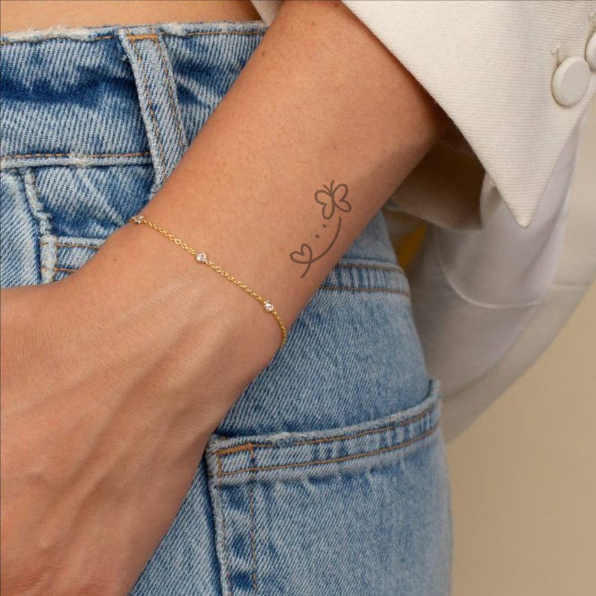 Subtle Charms Fade Away Tattoo