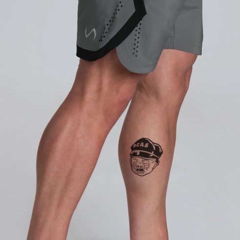 ACAB tattoo on the arm of a bully man. Kyiv. Ukraine